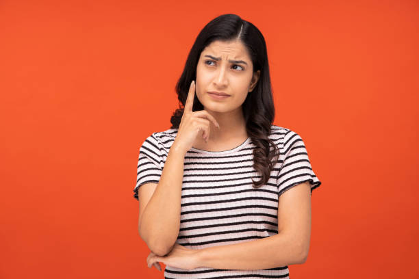 young woman on orange background, stock photo