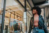 istock A young woman out shopping in the city 1291100364