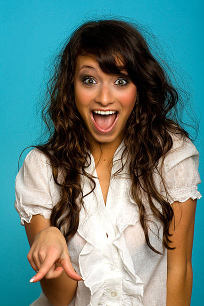 Young Woman Pointing and Laughing stock photo