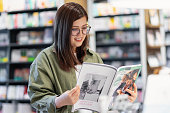 istock Young woman reading a magazine about mental health 1343545929