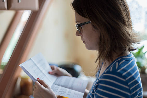 Young woman reading official letter stock photo