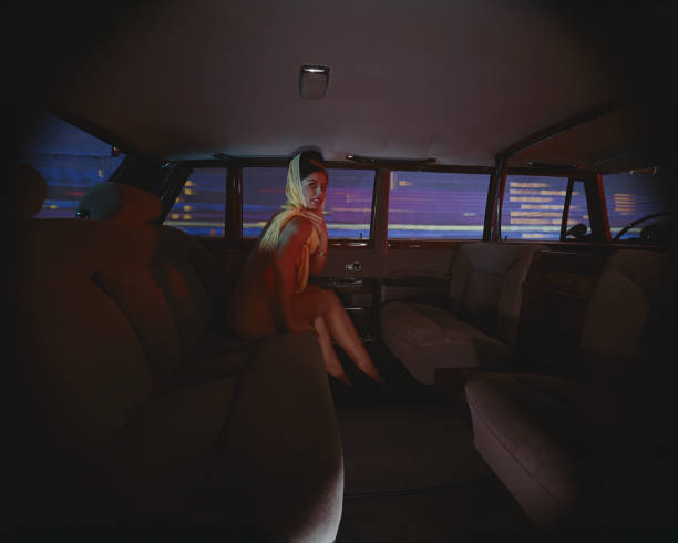 Young woman sitting in limousine, smiling, portrait  1964 stock pictures, royalty-free photos & images