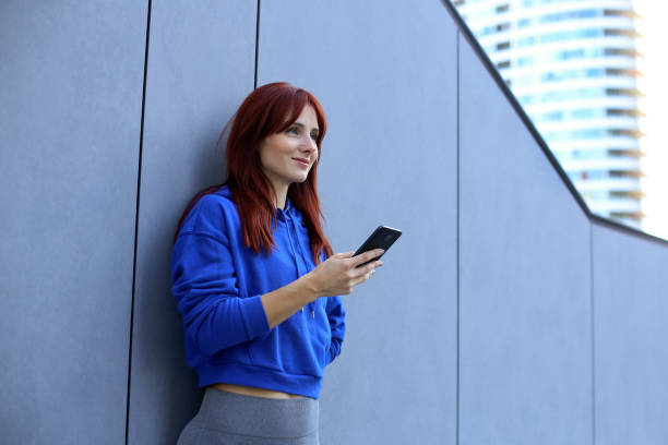 Young woman using a mobile app stock photo