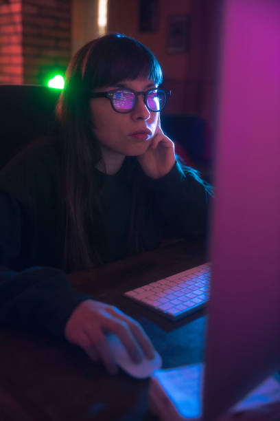 Young woman using computer stock photo