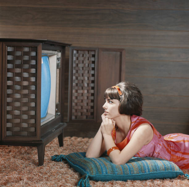Young woman watching television  1964 stock pictures, royalty-free photos & images
