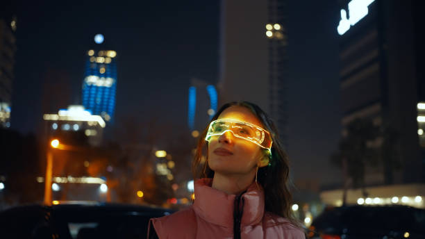 Young woman wearing augmented reality glasses stock photo