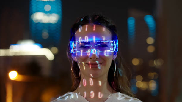 Young woman wearing augmented reality glasses stock photo