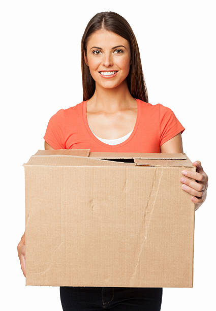 Young Woman With Cardboard Box - Isolated stock photo
