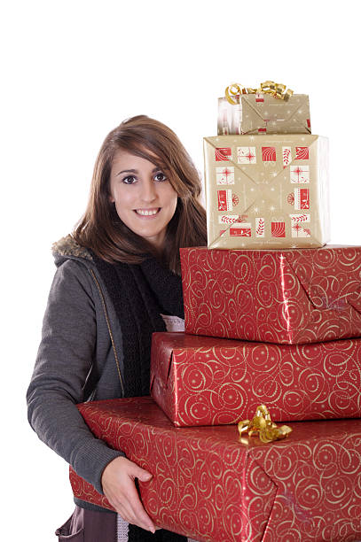 young woman with christmas presents stock photo