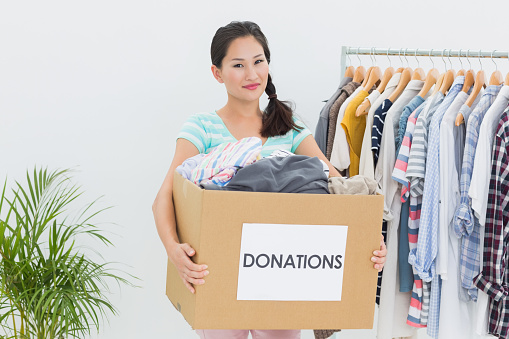 Young Woman With Clothes Donation Stock Photo - Download Image Now ...