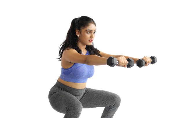Young Woman With Leg workouts with Dumbbells 
