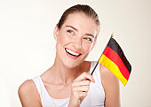 Beautiful smiling young woman holden Germany  flag. Adobe RGB