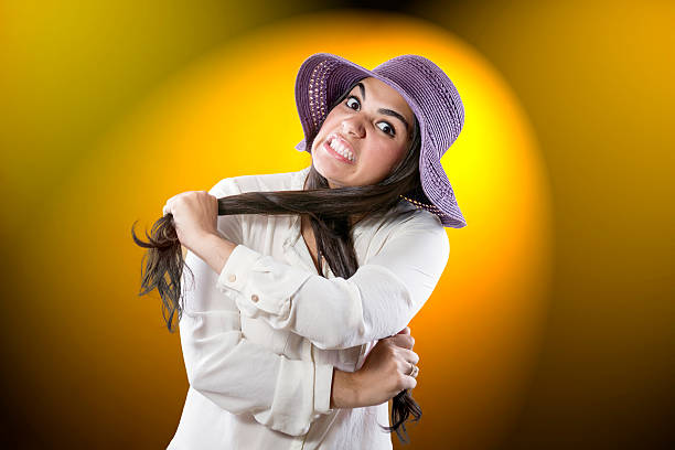 Young woman with purple hat knot stock photo