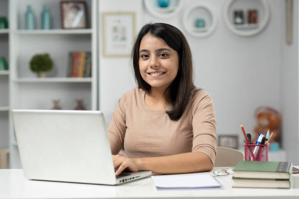Young woman working at home, stock photo stock photo