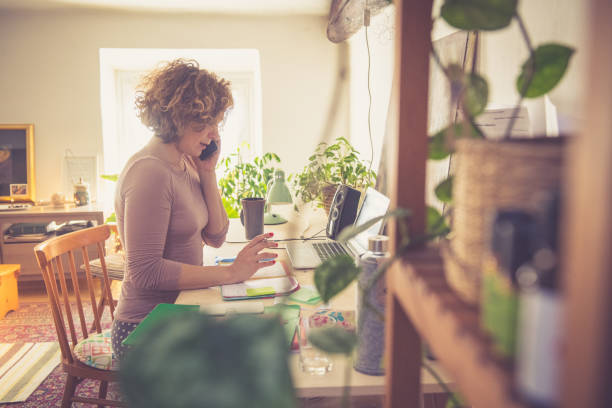 Young woman working from home stock photo