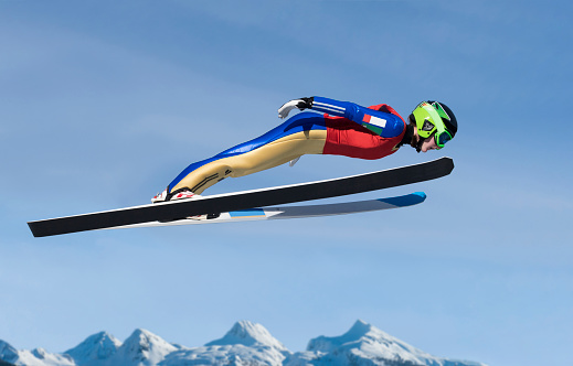 Side view of young  female ski jumper in mid-air