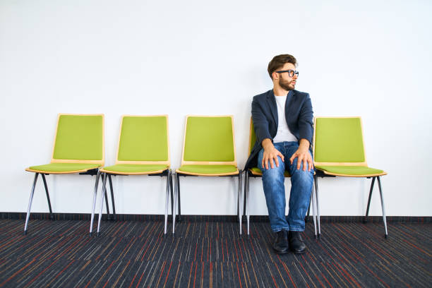 Young worried businessman waiting for job interview. Young worried businessman waiting for job interview. waiting stock pictures, royalty-free photos & images