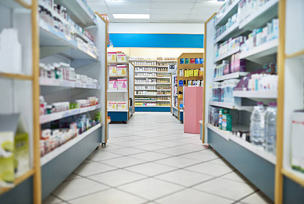 Your one stop pharmaceutical shop Shot of an aisle at a pharmacy. The commercial product(s) or designs displayed in this image represent simulations of a real product, and are changed or altered enough so that they are free of any copyright infringements. Our team of retouching and design specialists custom designed these elements for each photo shoot http://195.154.178.81/DATA/i_collage/pi/shoots/785200.jpg aisle stock pictures, royalty-free photos & images