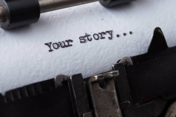 your story? The text is typed on paper with an old typewriter, a vintage inscription, a story of life. stock photo