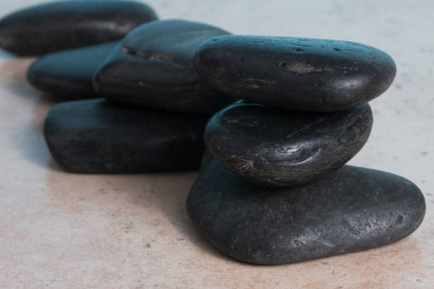 Zen black stone cairns stock photo