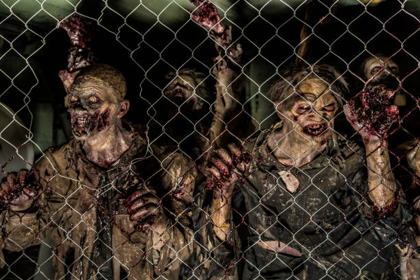 Zombies Behind A Fence Zombies Behind A Fence zombie stock pictures, royalty-free photos & images