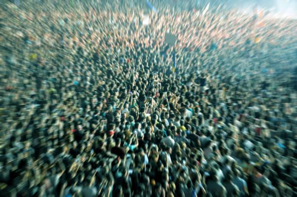 Zoom in effect on a blurred crowd stock photo