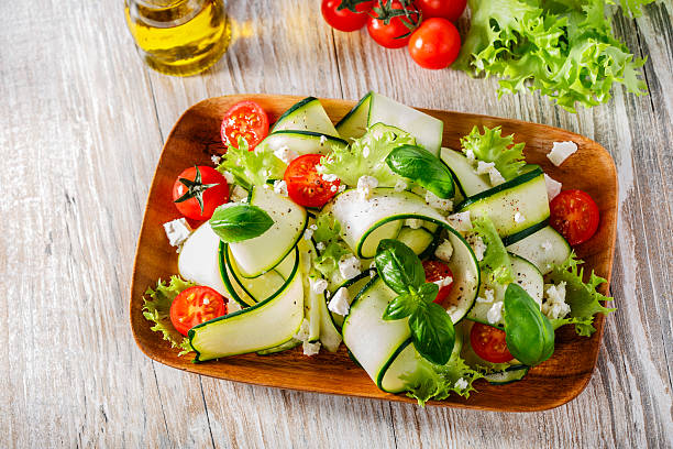 Zucchini salad with tomatoes and cheese stock photo