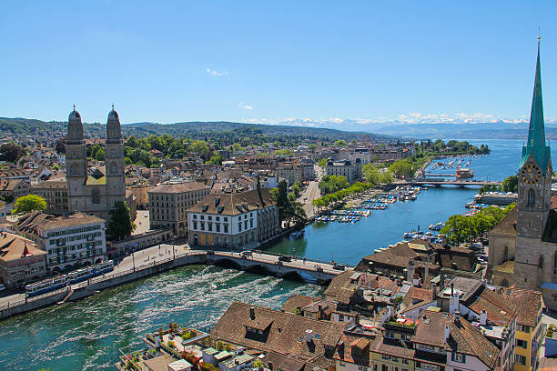 Zurich A view of the city centre of Zurich and the surrounding mountains.  zurich stock pictures, royalty-free photos & images