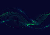 istock Abstract green wavy lines with dots particles and lighting on dark blue background. 1314330053