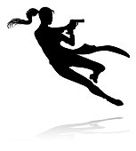 Silhouette woman in an action movie film shoot out pose