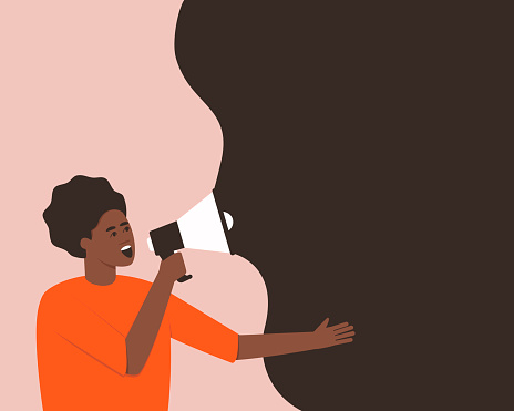 African American makes an announcement in a megaphone
