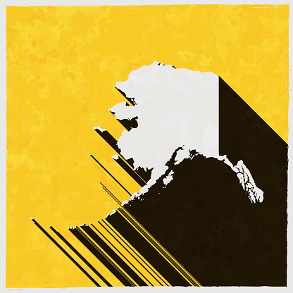 Map of Alaska in a trendy vintage style. Beautiful retro illustration with old textured yellow paper and a black long shadow (colors used: yellow, white and black). Vector Illustration (EPS10, well layered and grouped). Easy to edit, manipulate, resize or colorize. Vector and Jpeg file of different sizes.