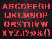 istock Alphabet Design - Red Letters on Carbon Fiber Background 529083395
