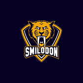 editable vector icon of an ancient sabertooth mascot icon shield with aggressive expression.