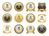 Vector illustration of the anniversary gold badge set