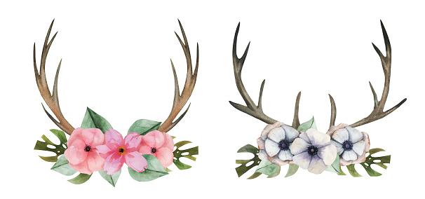 Aquarelle boho style horns with floral arrangement wreath.