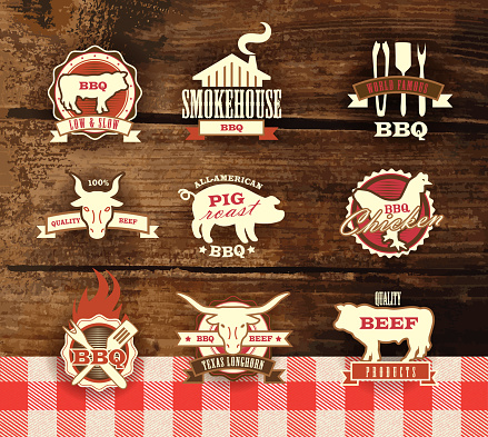 Assorted barbecue, beef, chicken and pork, labels on woodgrain background