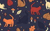Autumn fall seamless cats with fall leaves and mushrooms seamlessly repeating tileable pattern.