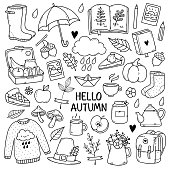 Hand drawn set of sketches: rubber boots,cloud, book, cup of tea, sweater, umbrella, pie, apple, mushrooms, leaves, flowers etc. Isolated objects on white background