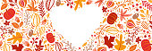 Autumn leaves, fruits, berries and pumpkins border heart frame background with space text. Seasonal floral maple oak tree orange leaves for Thanksgiving Day.