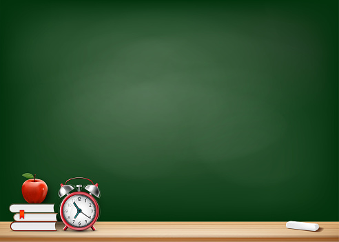 Background with blackboard books alarm clock and apple