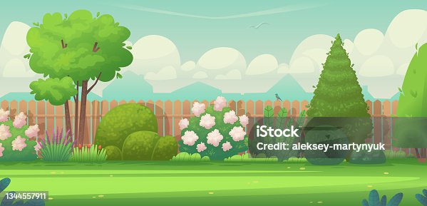 istock Backyard garden. Trees, bushes and cultivated plants against the background of the fence at the house 1344557911