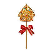 istock Baked cookie in shape of Gingerbread house on wooden stick in cartoon style. Cake pop with sweet biscuit for festive decoration isolated on white background. Vector illustration 1354446679