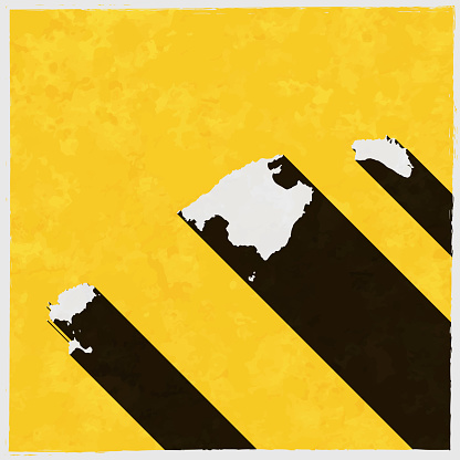 Balearic Islands map with long shadow on textured yellow background