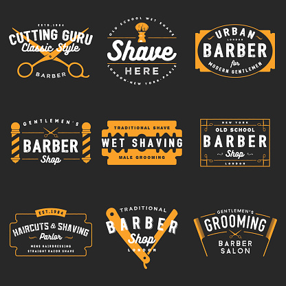 100% Vector set of vintage barber shop emblems.