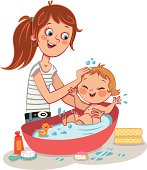 Mother and her baby having fun at bath time.