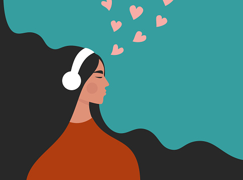 Beautiful young girl in headphones listening to music, radio, podcast or audio book. Melomaniac, music lover. Woman enjoying her favorite songs.