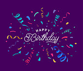 istock Birthday vector background with colorful confetti and serpentine ribbons isolated on dark backdrop at the center. Lettering script greeting text sign. Festive illustration in flat modern simple style 1329407781
