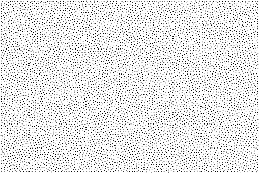 Black and white grainy abstract background. Halftone - pointillism pattern with random dots.