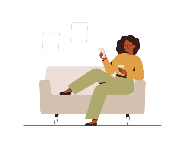 Black businesswoman sits on the couch at home or in the office with a mobile phone at break time. Black businesswoman sits on the couch at home or in the office with a mobile phone at break time. Young dark skin female drinks coffee and using a smartphone. Flat cartoon vector illustration. black woman using phone stock illustrations